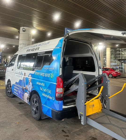 Multicare wheelchair accessible van with its side door open