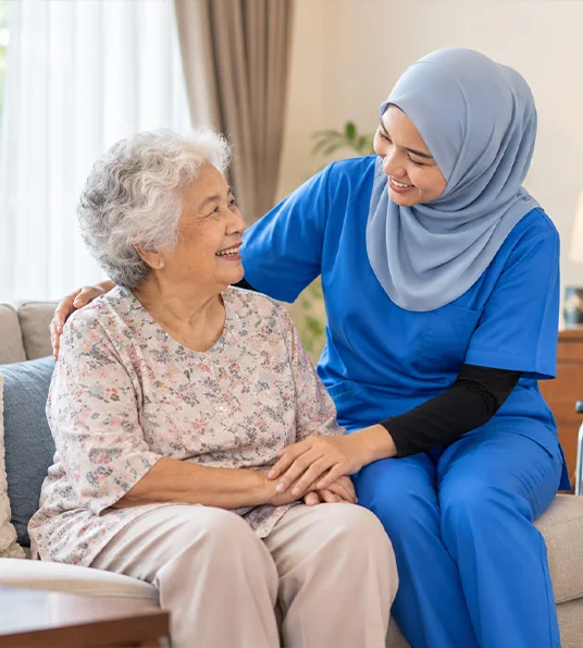 Caregiver talking with an elderly resident
