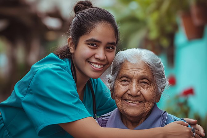 Caregiver sitting with an elderly resident outdoors
